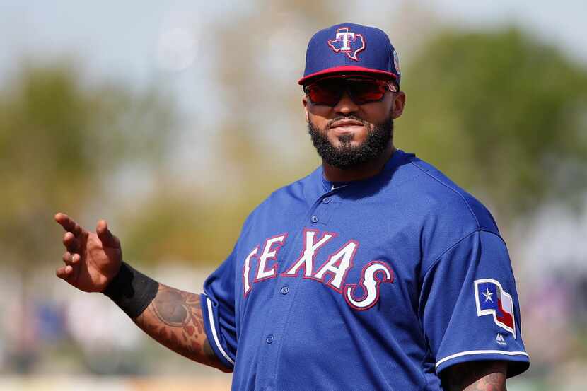 SURPRISE, AZ - MARCH 02:  Infielder Prince Fielder #84 of the Texas Rangers reacts during...