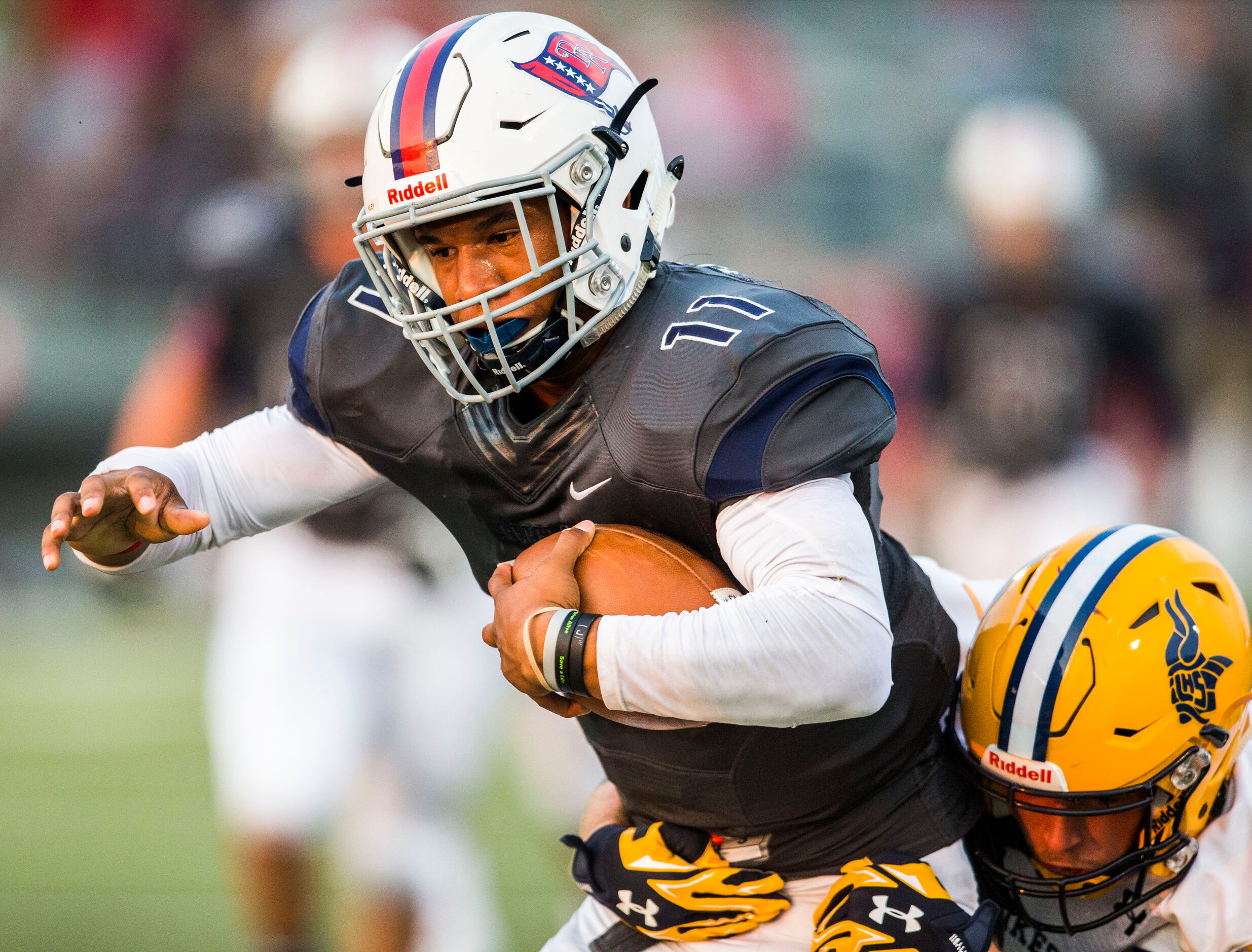 Arlington Lamar High School free safety James Sturgeon (3) tackles Richland High School...