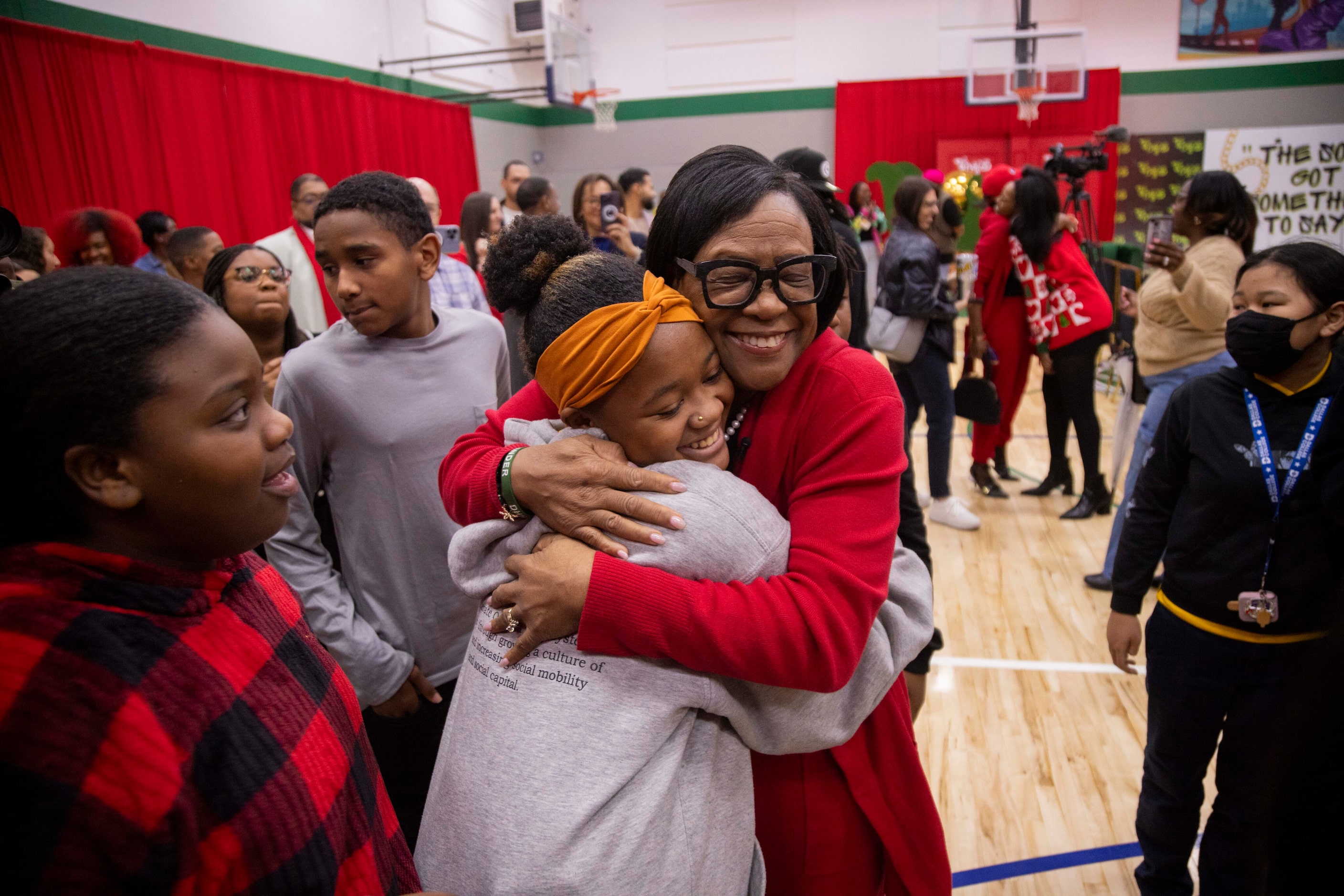 Cynt Marshall, chief executive officer of the Dallas Mavericks, hugs Lawreicia Henderson,...