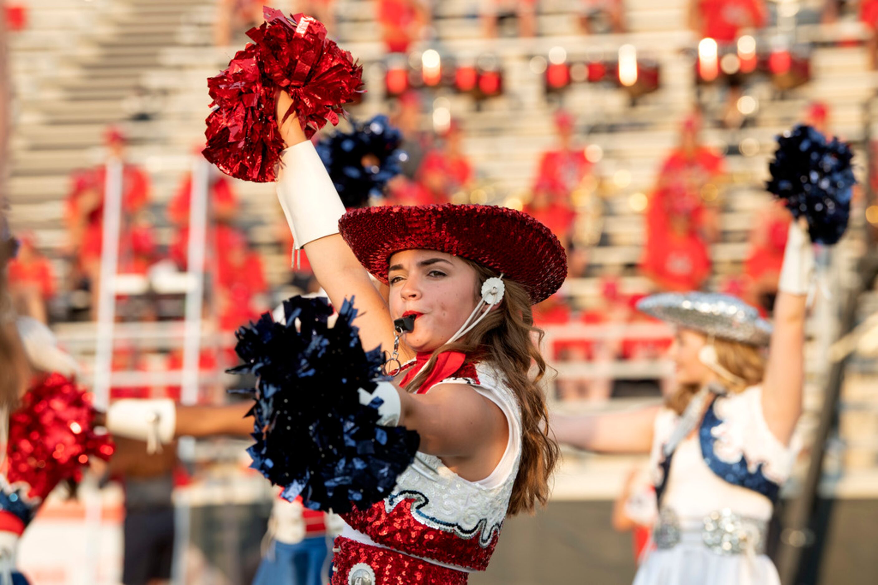 Reagan Cook, captain of the McKinney Boyd Bailadoras drill team, performs before a high...