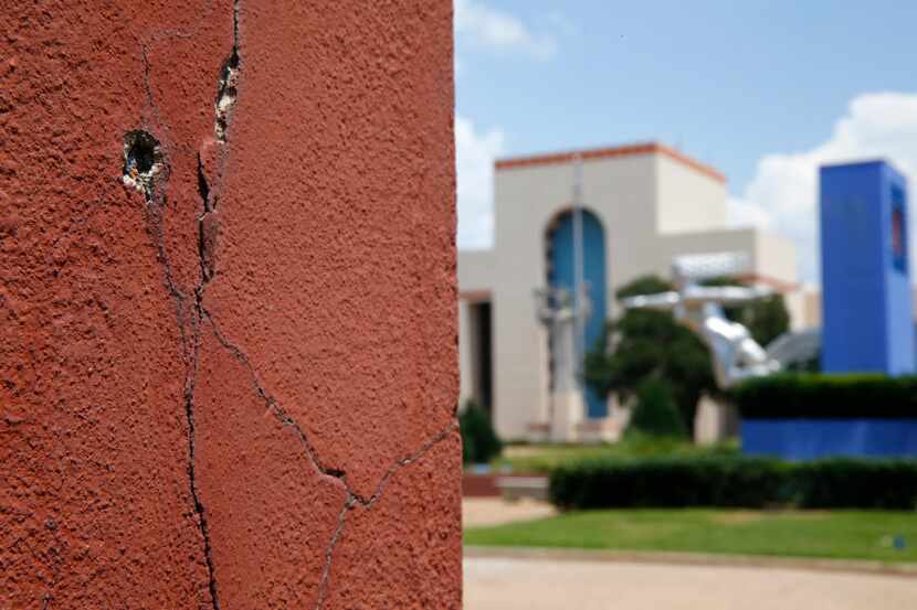 A crack in one of the automobile buildings at Fair Park in Dallas on June 27, 2017. Dallas...