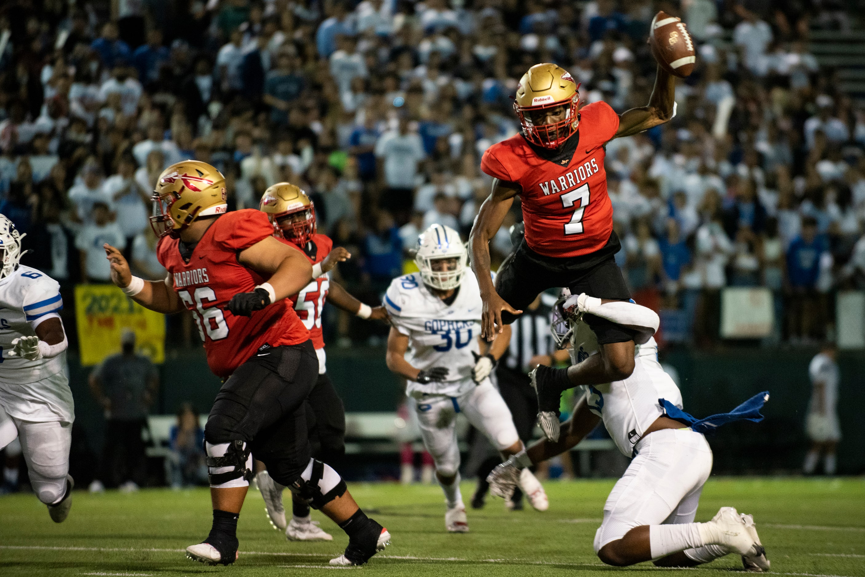 South Grand Prairie senior Michael Stallworth (7) attempts to leap over Grand Prairie senior...