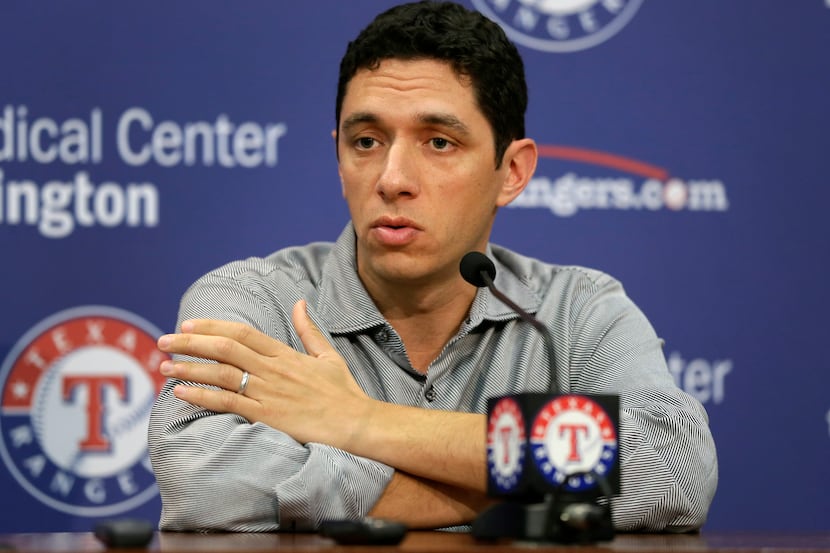 Texas Rangers president of baseball operations and general manager Jon Daniels responds to a...
