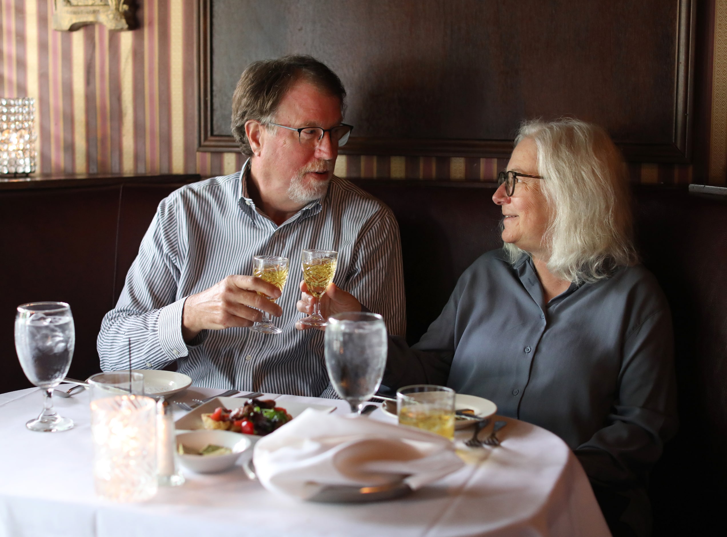 Douglas Potts, left, and Sally Potts enjoy a meal at St. Martin's Wine Bistro in Dallas, TX,...