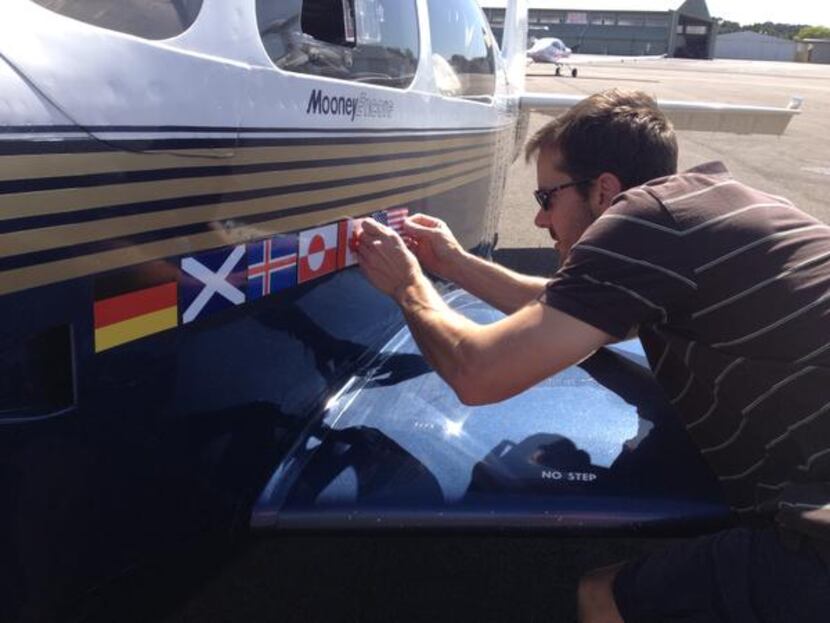 
Schroen applied another sticker to the plane after he and his co-pilot visited another...