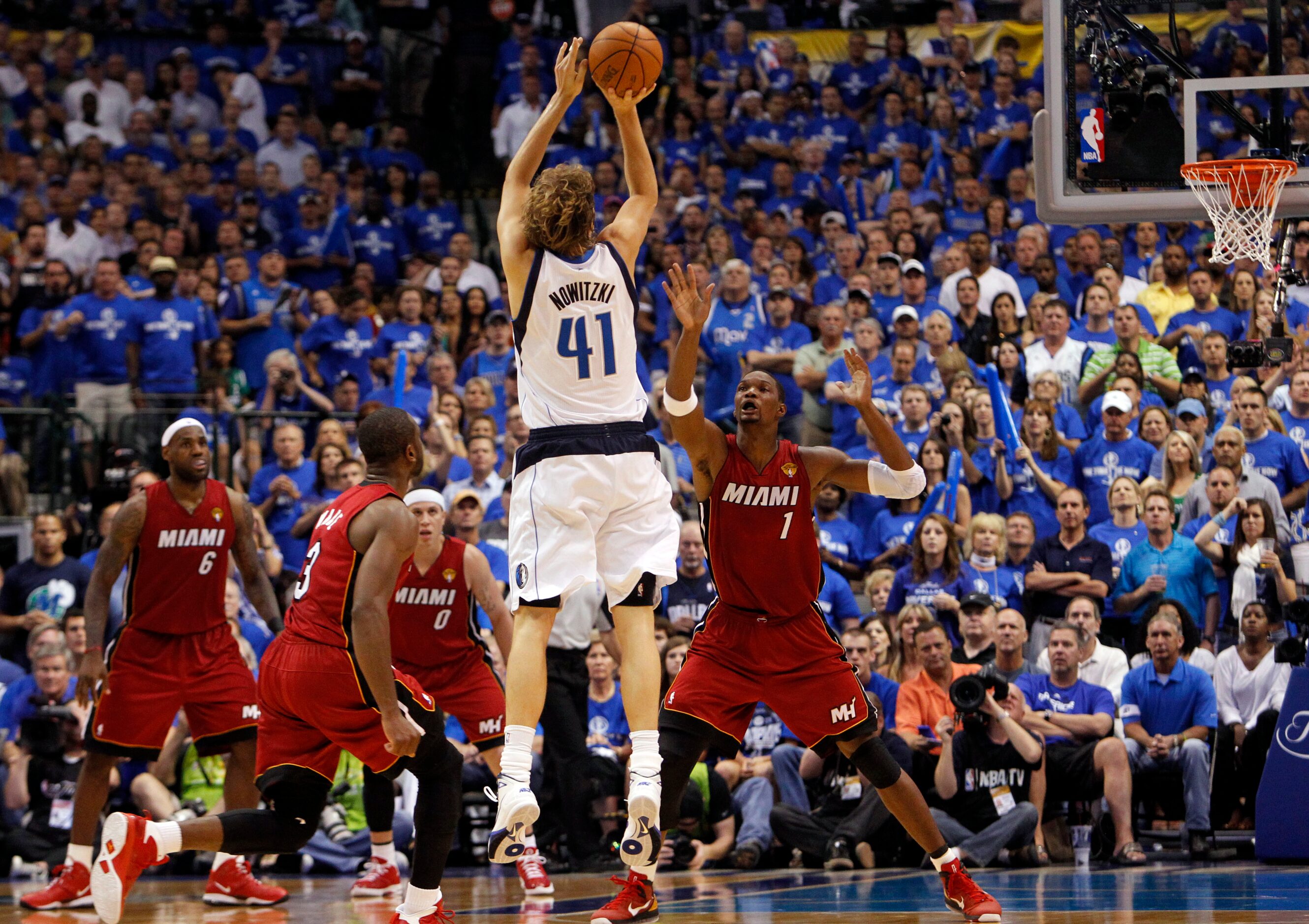 Dallas Mavericks power forward Dirk Nowitzki (41) hits a three pointer against Miami Heat...