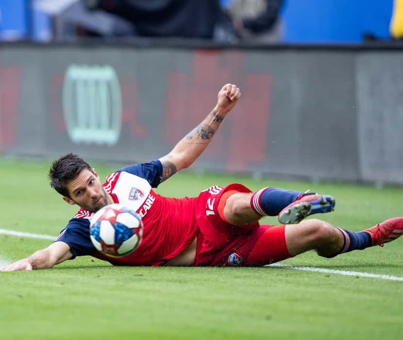 FRISCO, TX - MARCH 23: FC Dallas defender Ryan Hollingshead (#12) saves a ball from going...