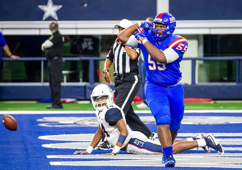 Duncanville defensive lineman De'Braylon Carroll (55) flexes in celebration after sacking...