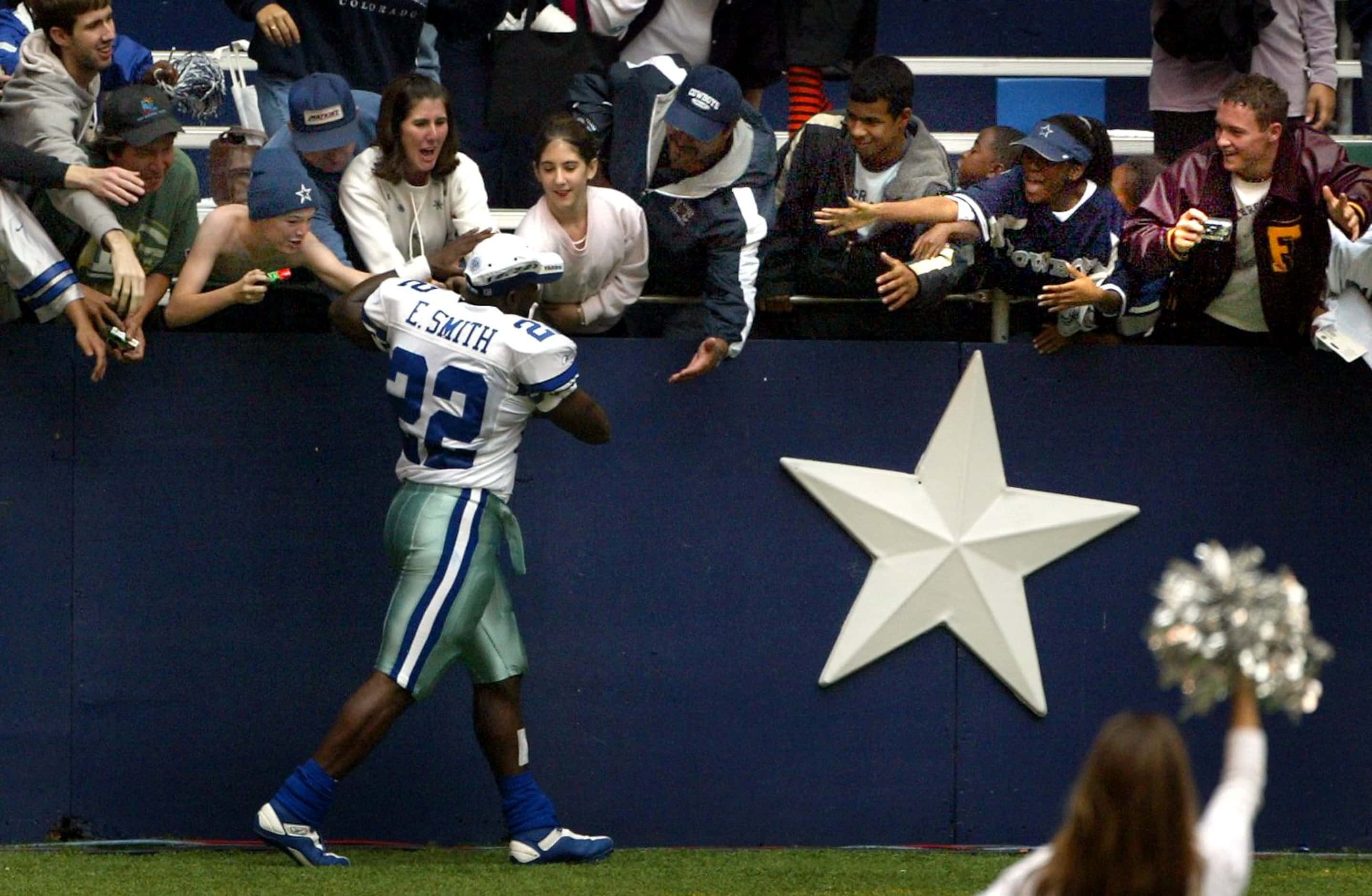 Dallas Cowboys fans congratulate running back Emmitt Smith during a post-game ceremony...