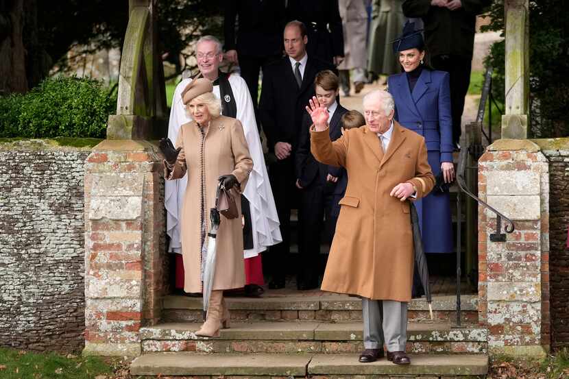 Britain's King Charles III and Queen Camilla leave after attending the Christmas day...