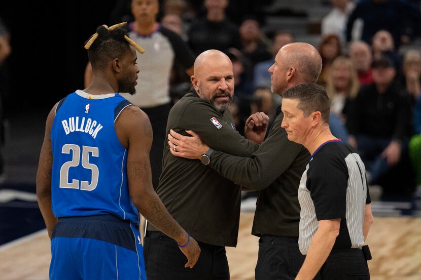 Dallas Mavericks head coach Jason Kidd, second from left, reacts after being ejected during...