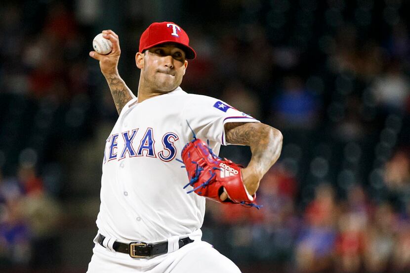 Texas Rangers relief pitcher Matt Bush pitches during the ninth inning against the Tampa Bay...