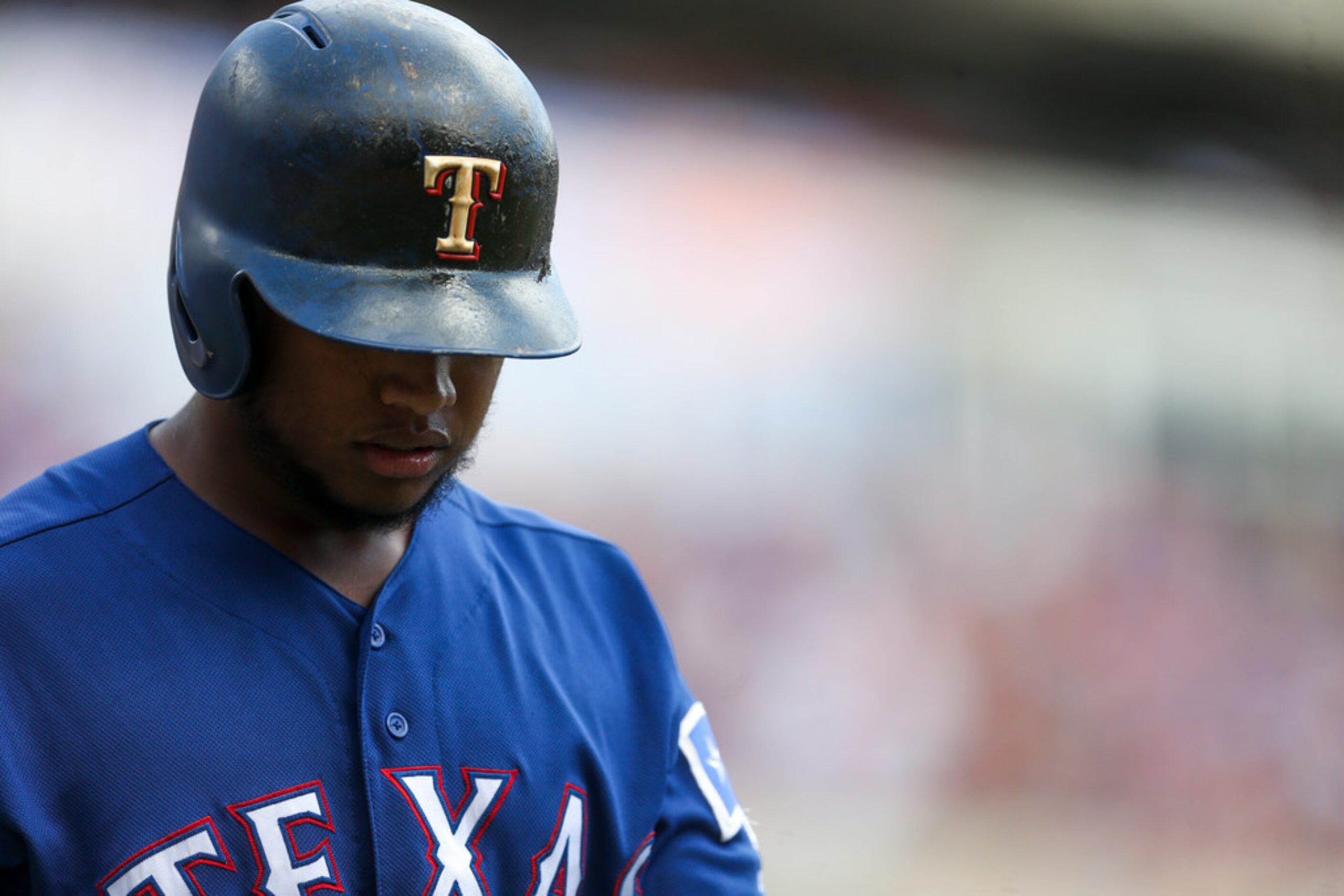 Texas Rangers left fielder Willie Calhoun (5) walks back into the dugout during a MLB game...