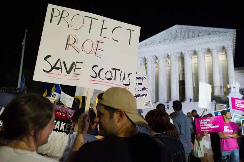 Demonstrators gathered in front of the Supreme Court in Washington after President Donald...