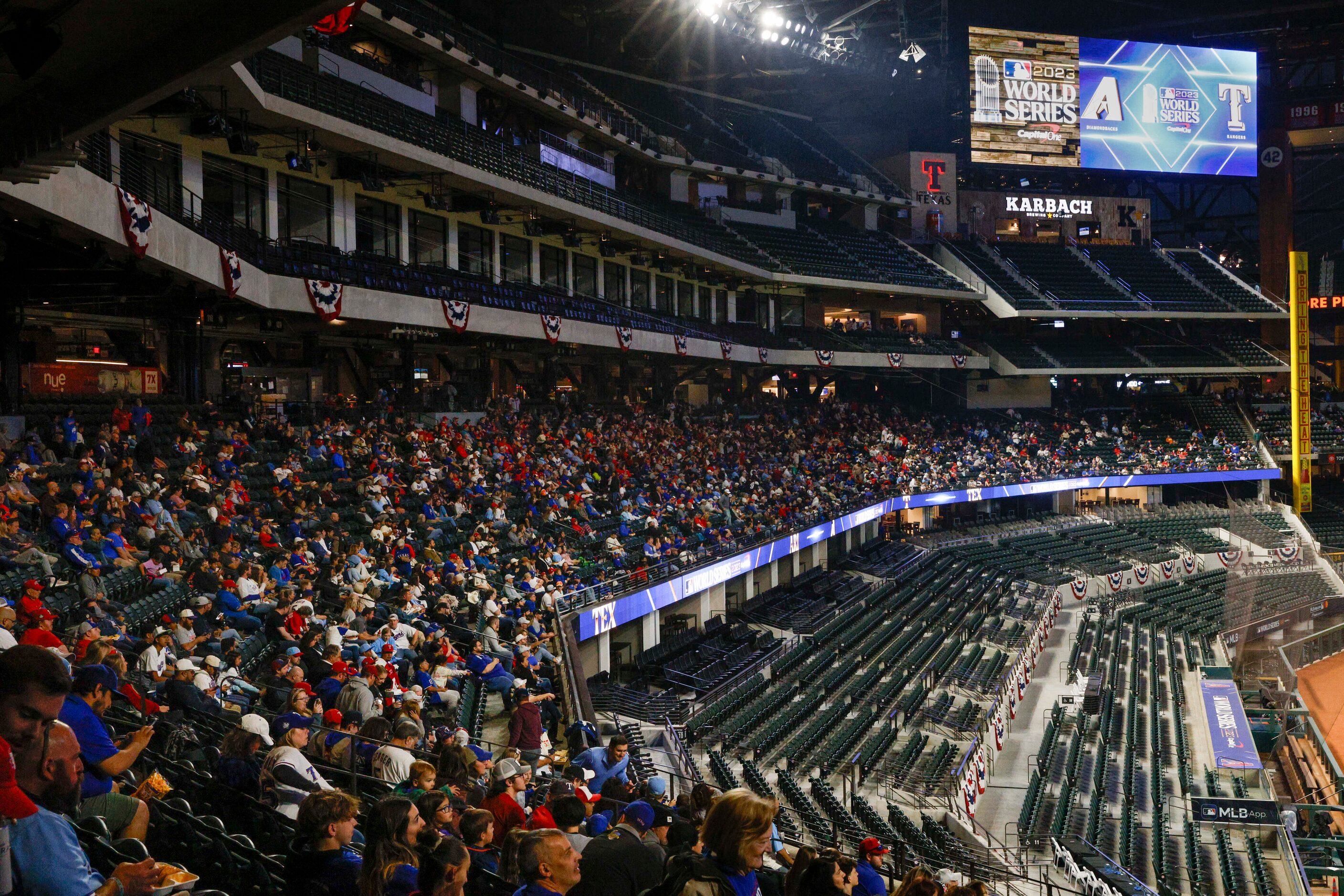 Texas Rangers fans fill the main concourse before Game 3 of the World Series at a watch...