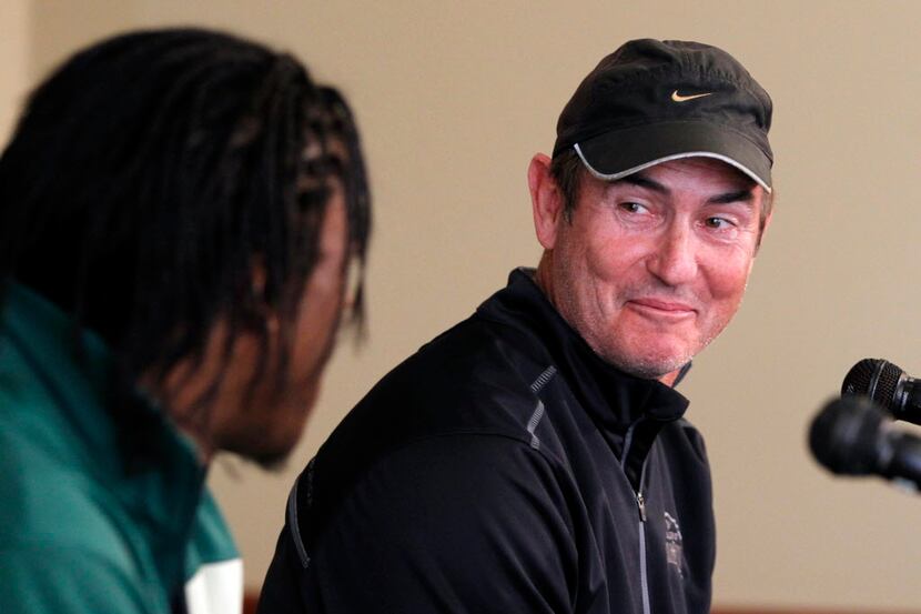 Baylor University head coach Art Briles laughs with quarterback Robert Griffin III during a...