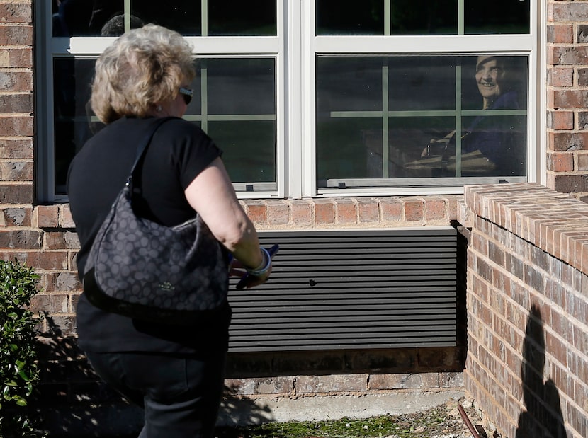 Cindy Goleman visited her mother, Peggy White, from outside the window last week at The...