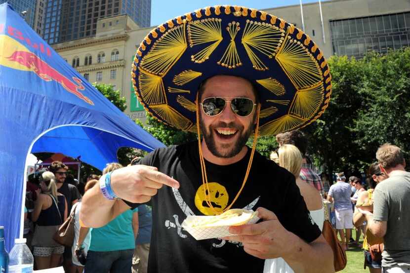 Wes Chambers enjoys tacos at Taco Libre at Main Street Garden in Dallas, TX on June 27, 2015.