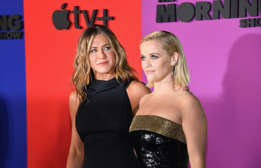 Jennifer Aniston (L) and Reese Witherspoon arrive for Apple's "The Morning Show" global...