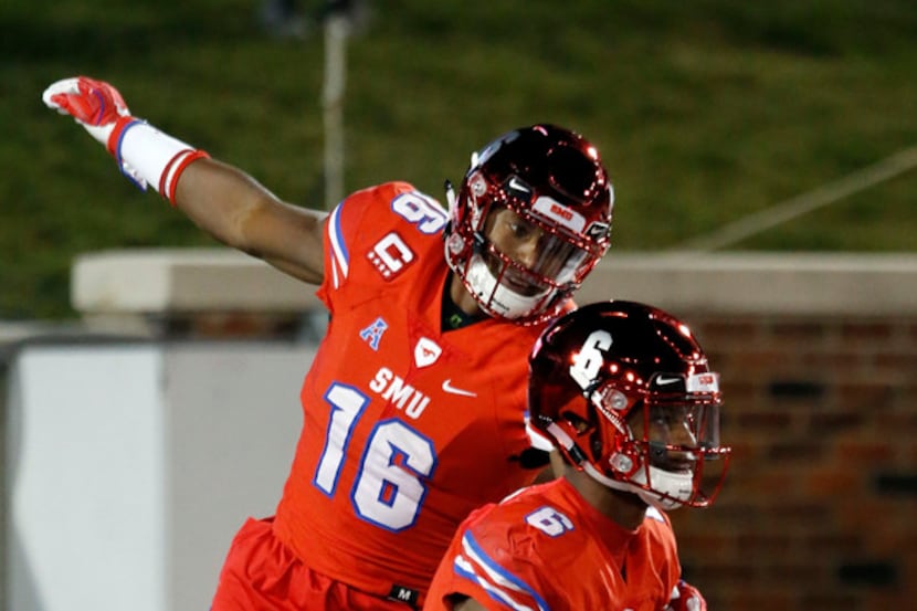 Southern Methodist's Braeden West (6) and Cortland Sutton (16) celebrate after West's...