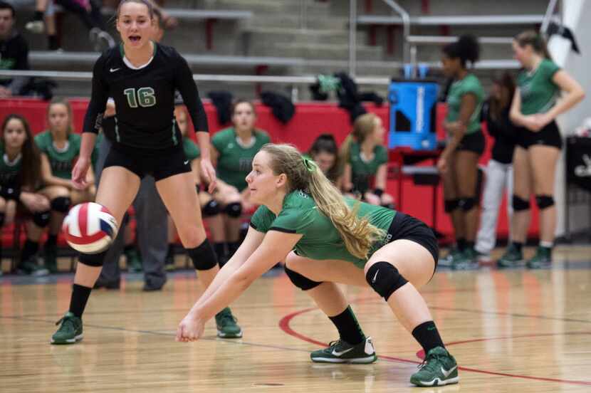 Southlake Carroll senior outside hitter Megan Porter digs a hit by Allen during their...