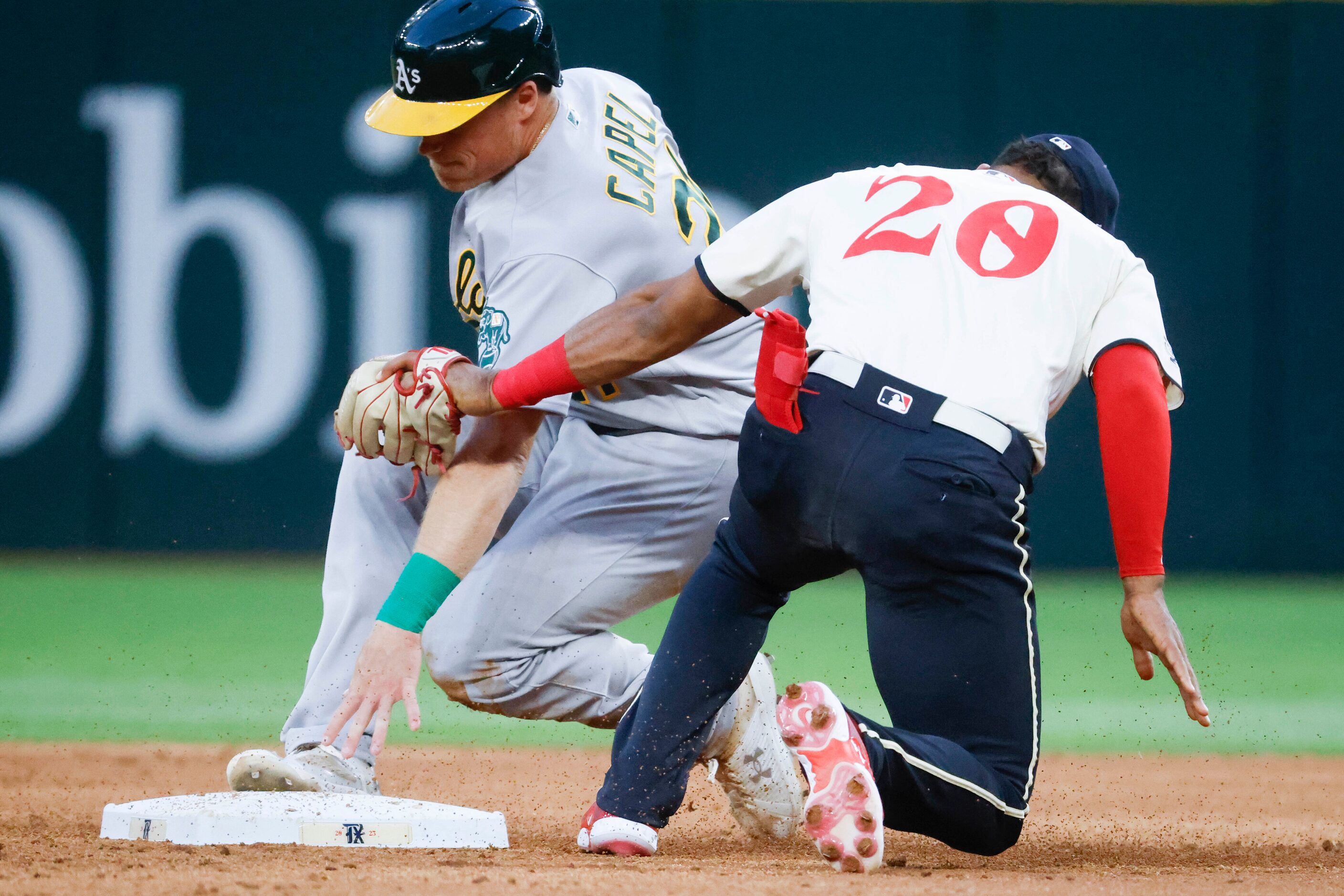 Oakland Athletics left fielder Conner Capel caught stealing 2nd base past Texas Rangers left...