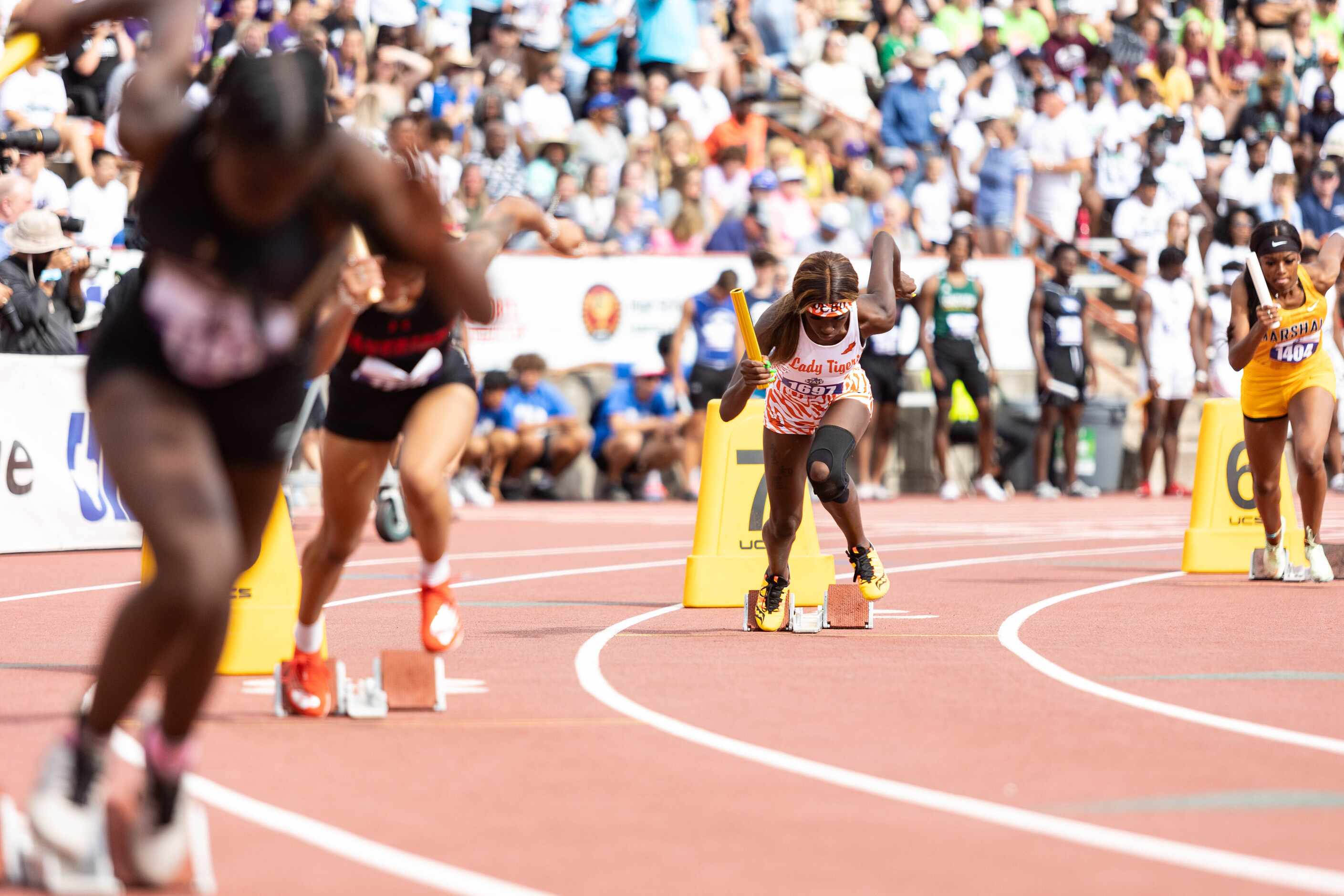 Leeira Williams leads off the girls’ 4x100 relay for the Lancaster Lady Tigers at the UIL...