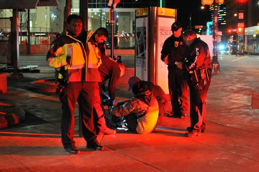 DART Officer Stephanie Branch (left) looks at photographer Avi Adelman in February 2016...