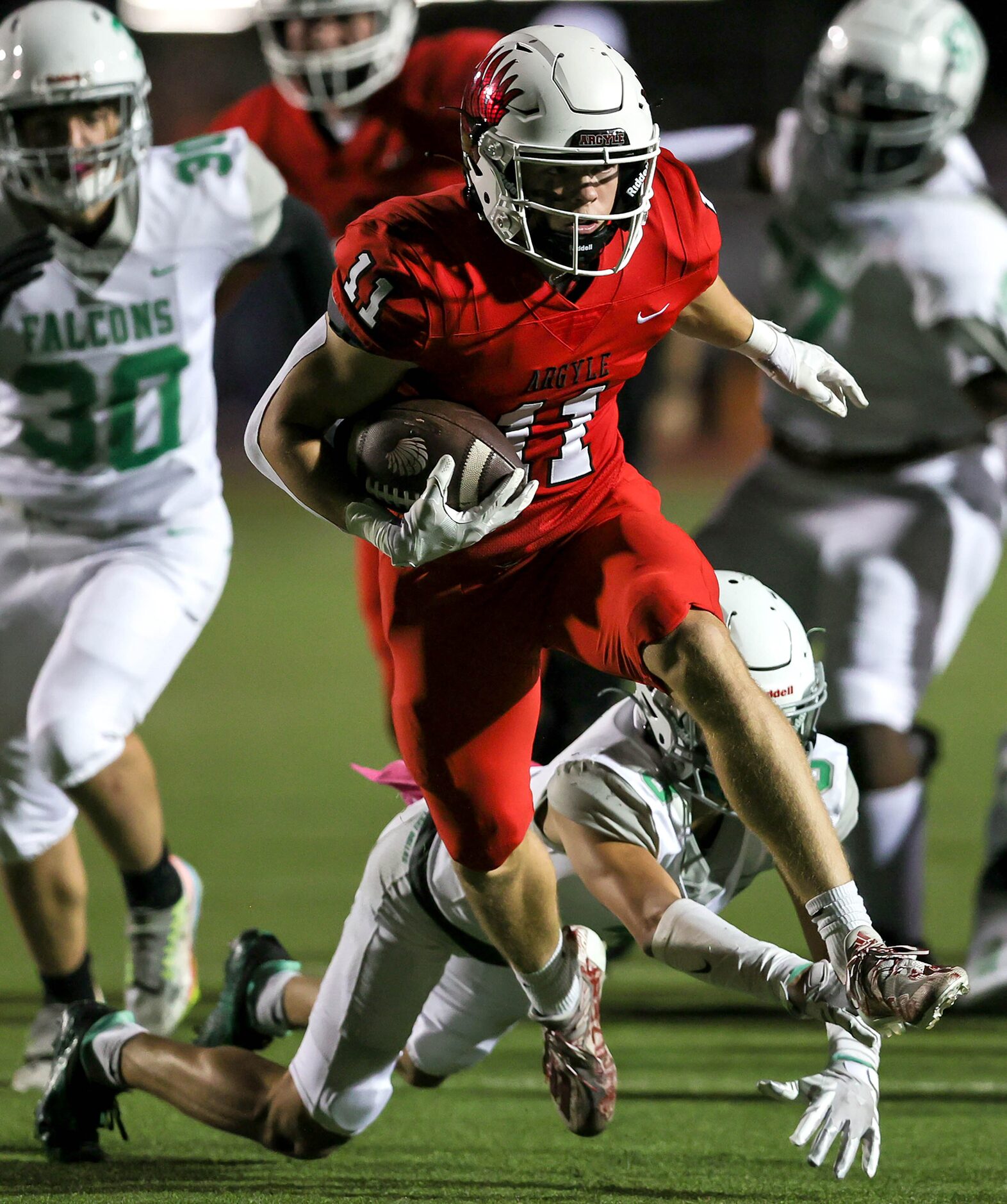 Argyle running back RJ Bunnell (11) breaks free from Lake Dallas defensive back Xinjin Gomez...