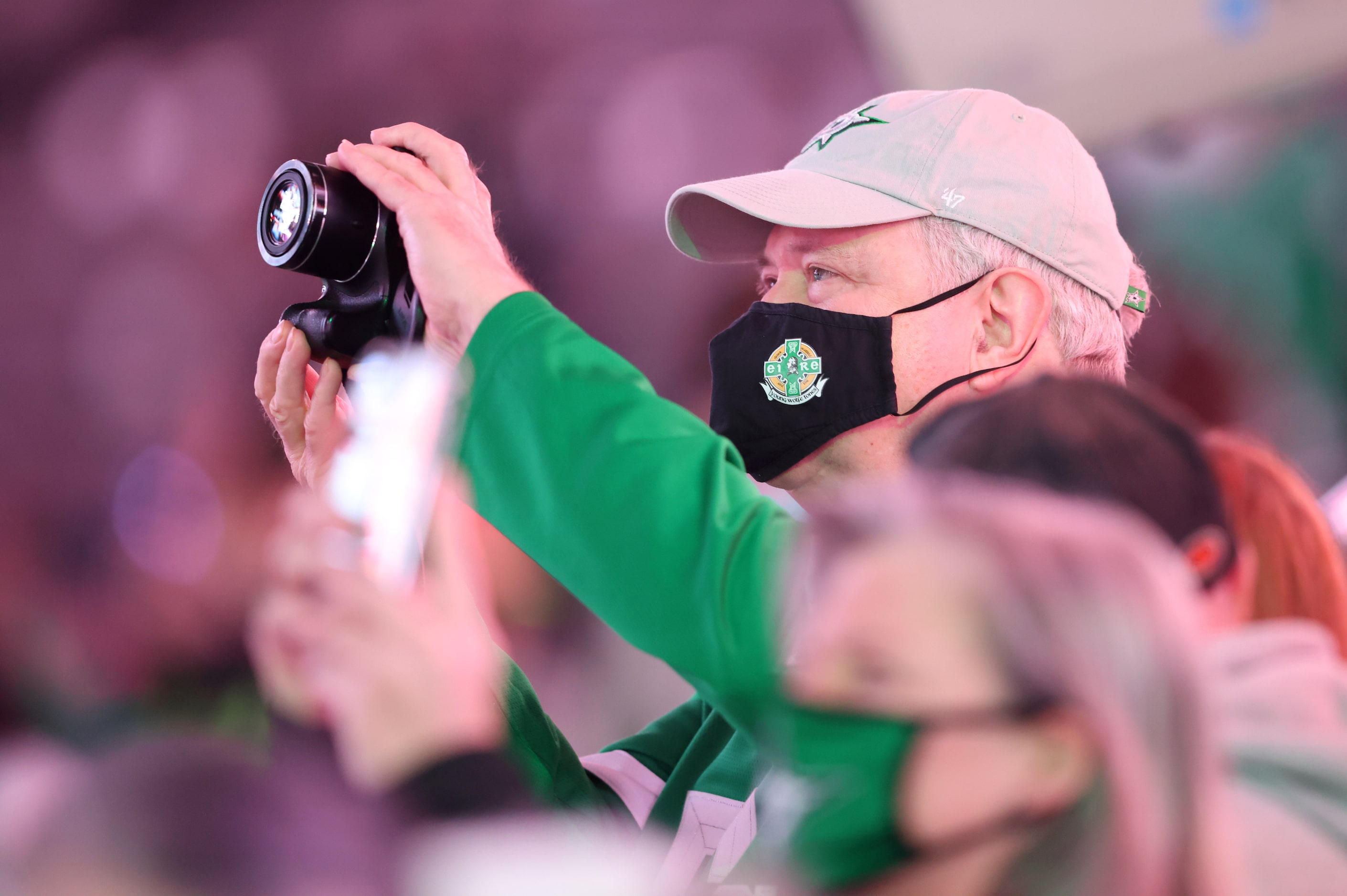 Dallas Stars fans take photos of the Western Conference Champions banner prior to the start...