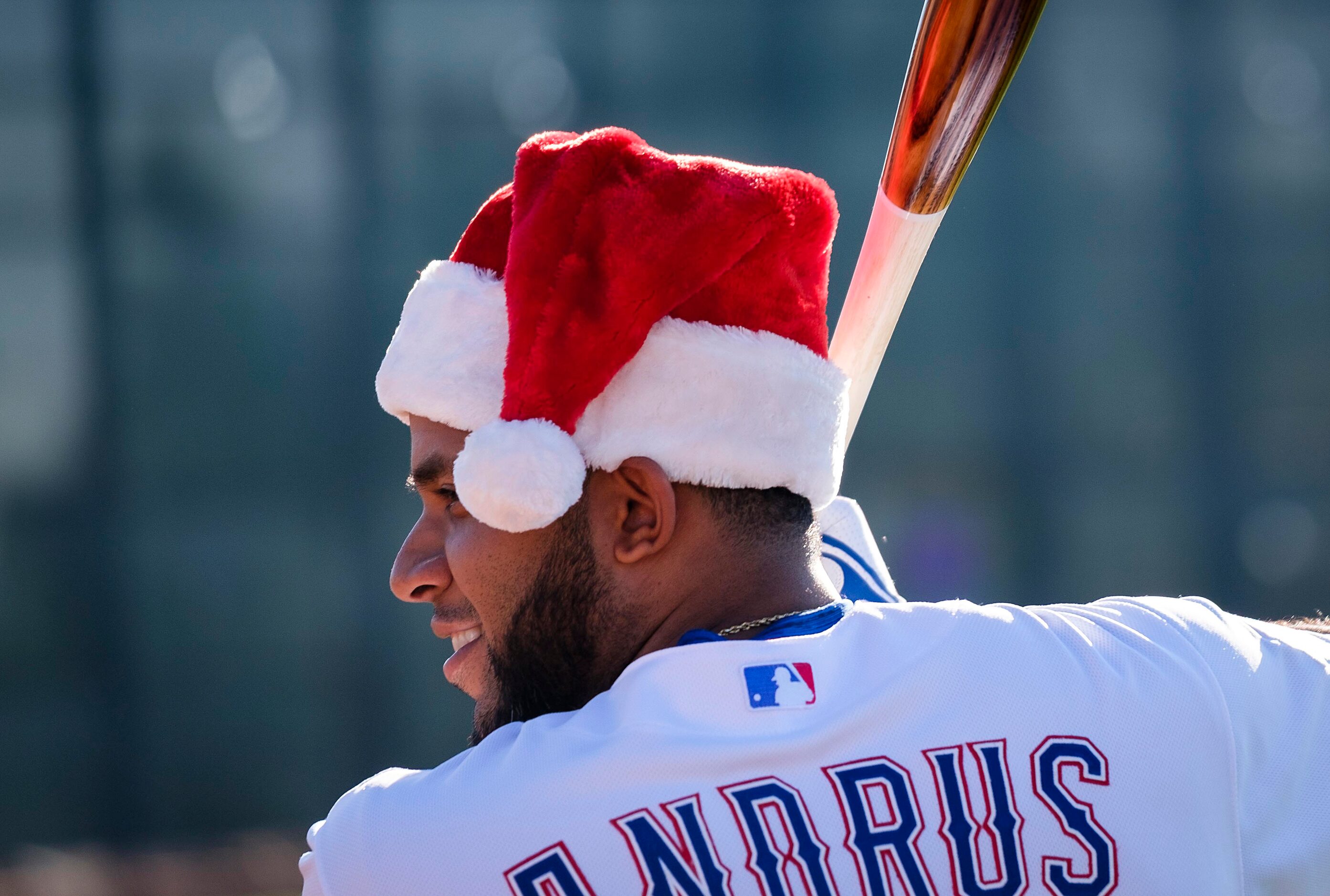 Texas Rangers shortstop Elvis Andrus poses for a photographer wearing a Santa hat during...