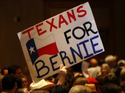  Signs supporting Democratic presidential candidate Bernie Sanders at the Sheraton Dallas on...