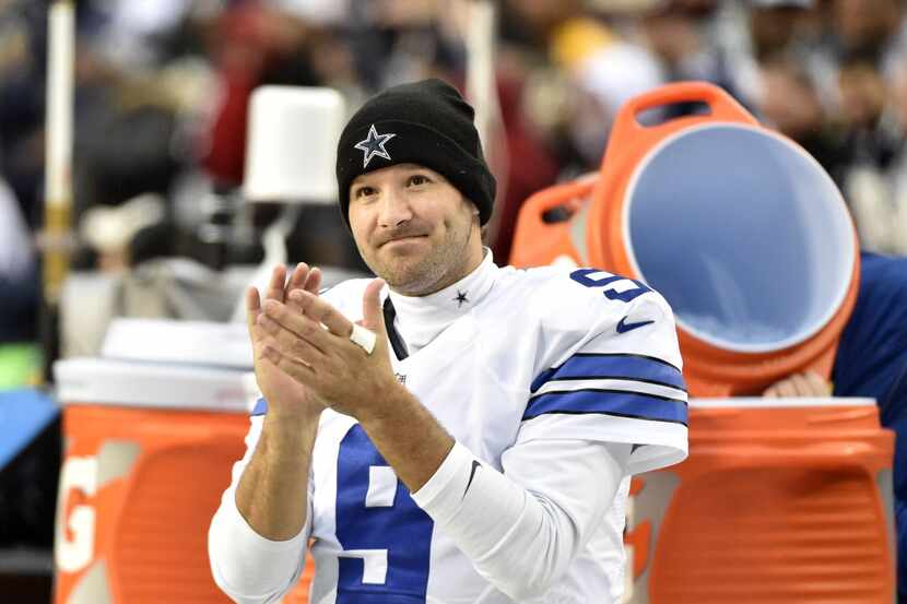 Dallas Cowboys quarterback Tony Romo (9) claps a after a late fumble recovery as they played...