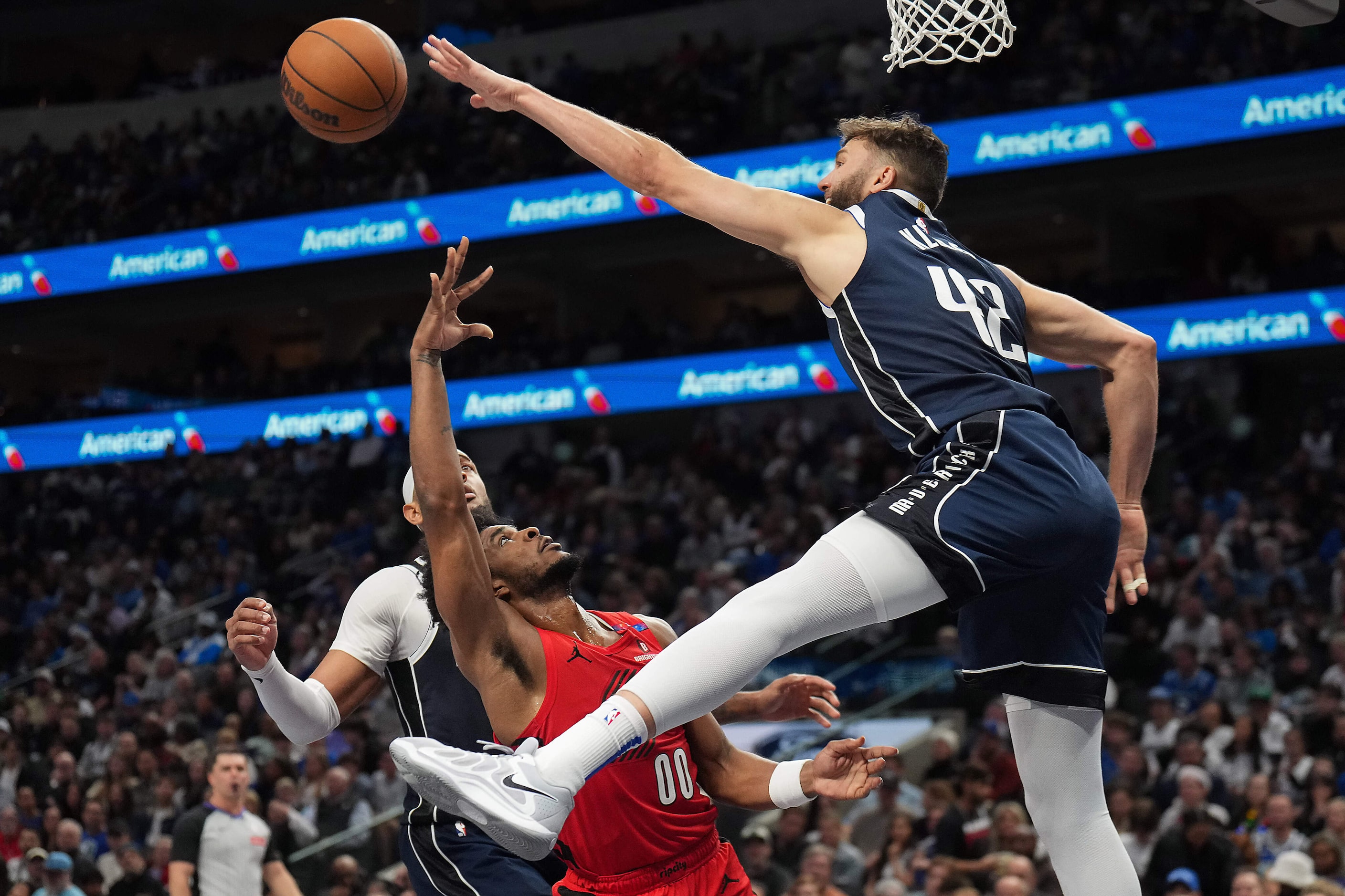 Dallas Mavericks forward Maxi Kleber (42) blocks a by Portland Trail Blazers guard Scoot...