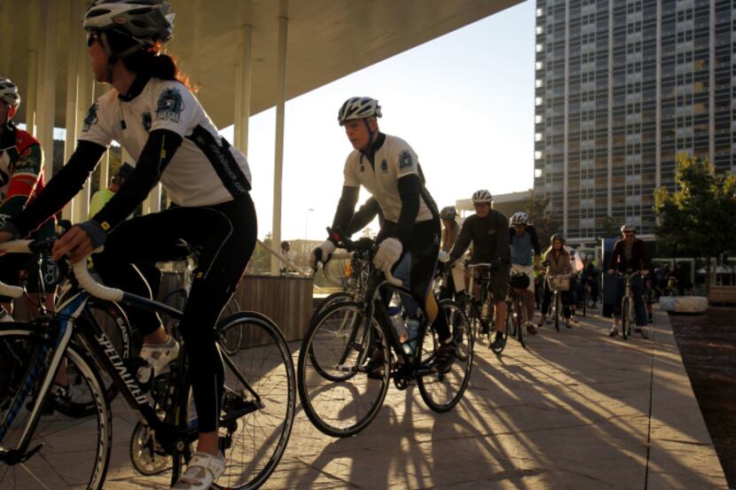 City Council members, city staff and bicycle enthusiasts rode through downtown Dallas on...