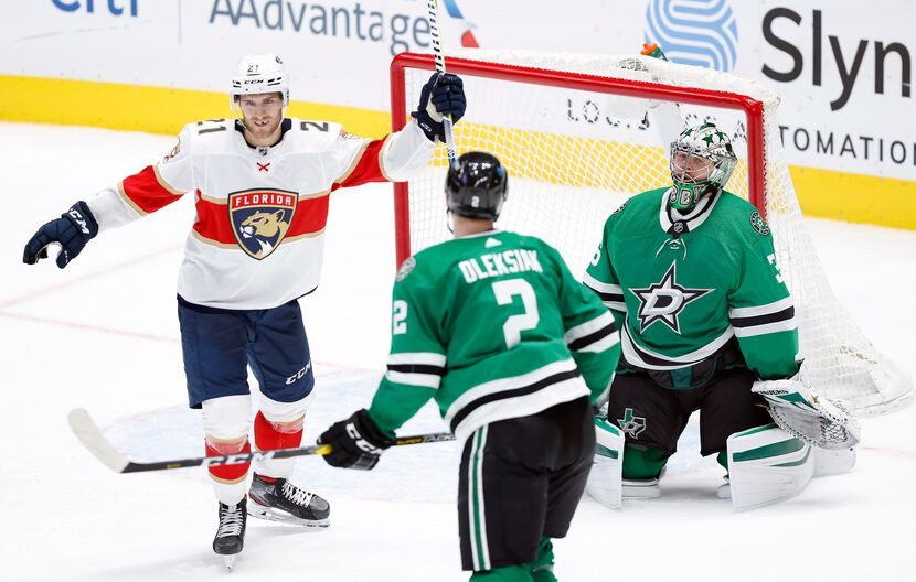 Florida Panthers center Alex Wennberg (21) celebrates center Frank Vatrano's overtime goal...