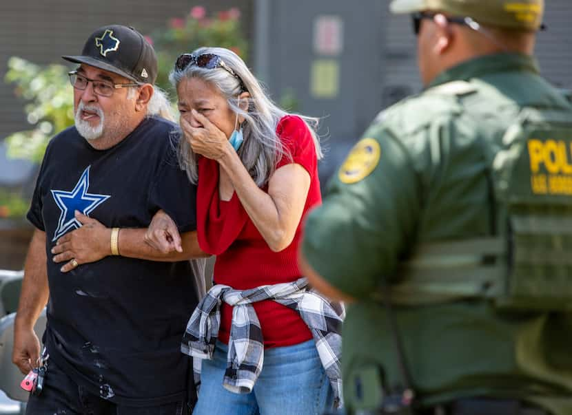 A woman cries as she leaves the Uvalde Civic Center on May 24, 2022, in Uvalde.