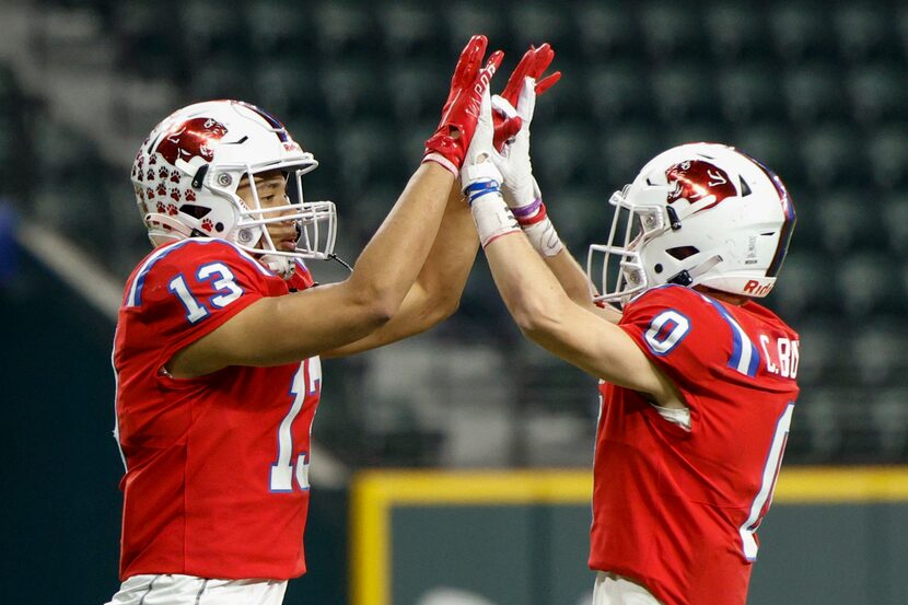 Parish Episcopal wide receiver Bryson Fields (13) high-fives wide receiver Chase Burton (0)...