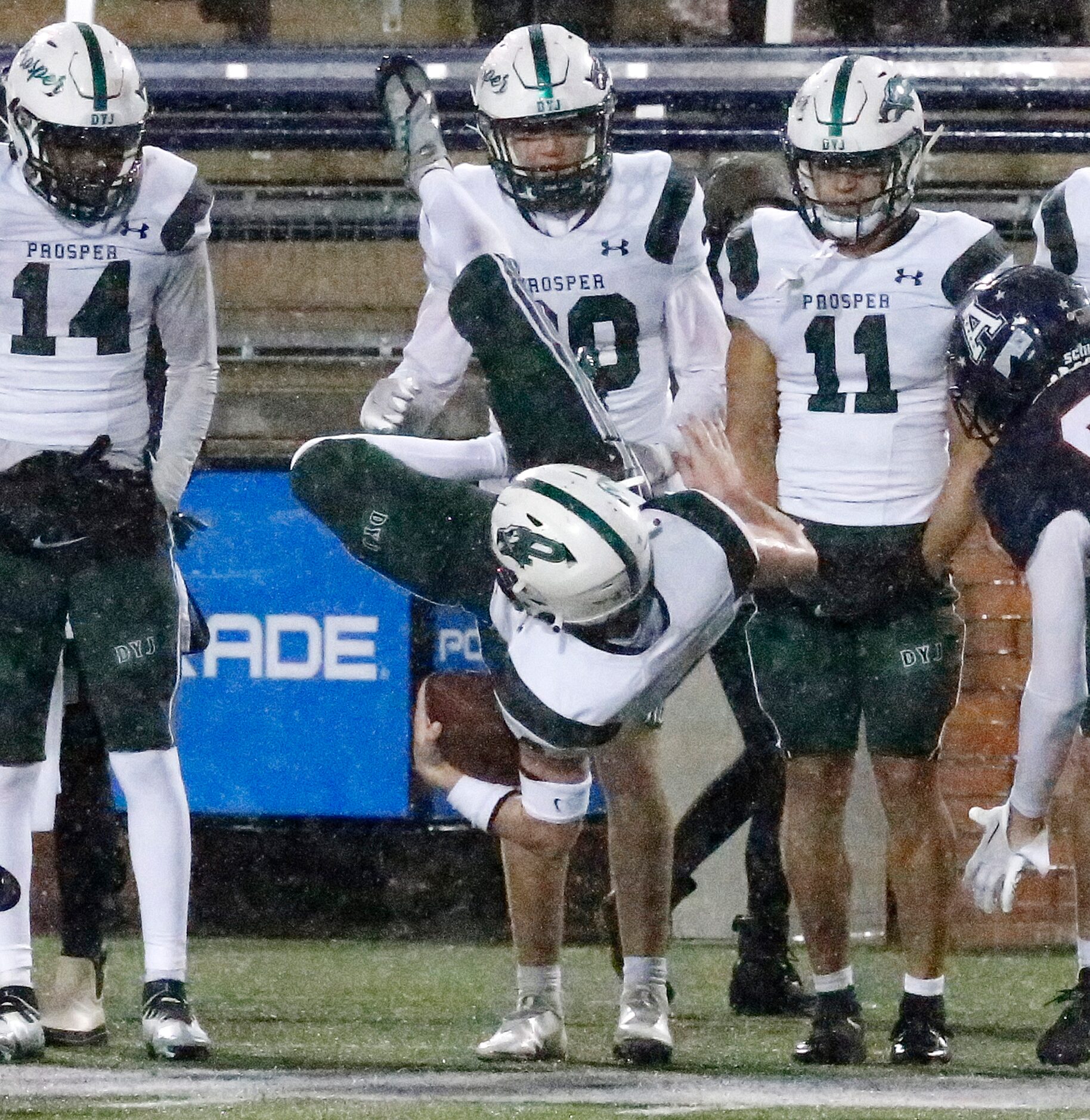 Prosper High School wide receiver Allen Wimberly (8) is upended after a catch during the...