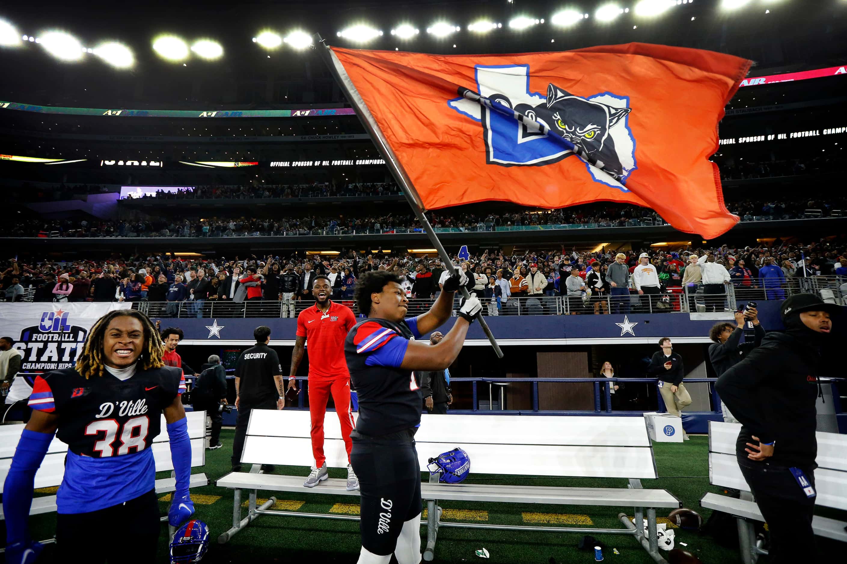 Duncanville offensive lineman Rasheed Jackson (75) waves the school flag in the closing...