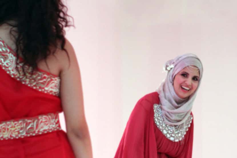 Zeena Alkurdi waited for models to walk the runway during a Muslim fashion show she...