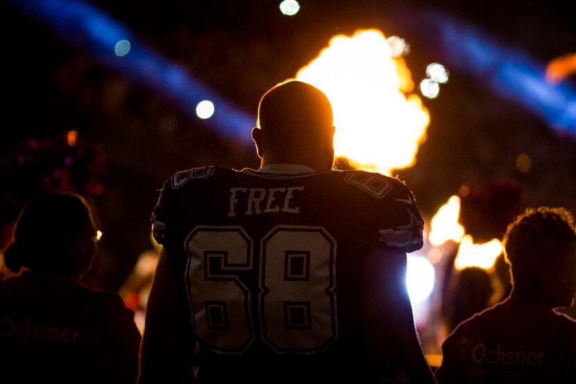 Pyrotechnics go off in front Dallas Cowboys tackle Doug Free (68) before an NFL football...