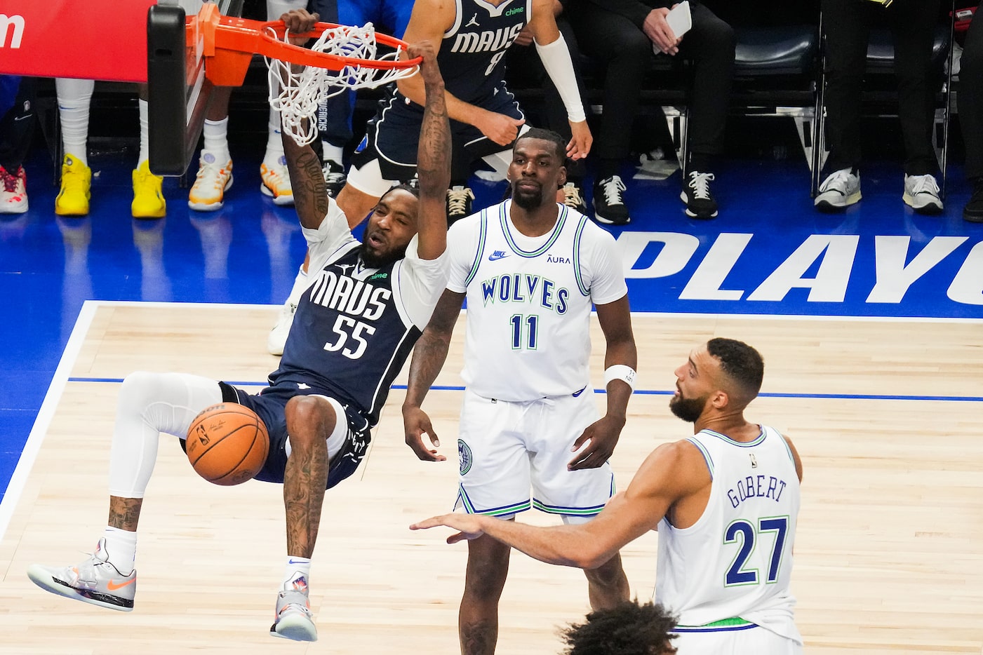 Dallas Mavericks forward Derrick Jones Jr. (55) dunks the ball past Minnesota Timberwolves...