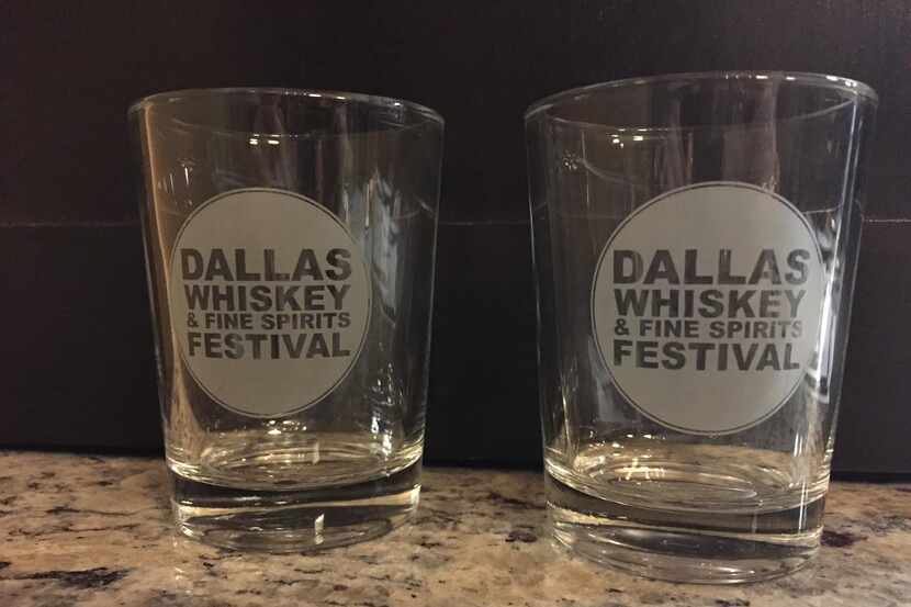 Attendees used these branded tasting glass to sip on samples of whiskey and other drinks at...