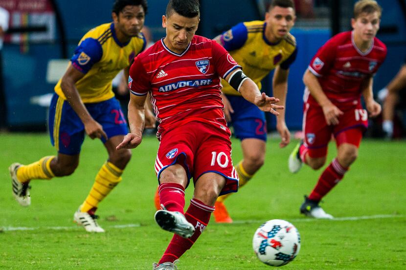 FC Dallas midfielder Mauro Diaz (10) takes a penalty kick resulting in a goal in the 44th...