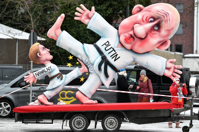 A political carnival float depicting Russia's President Vladimir Putin fighting with...