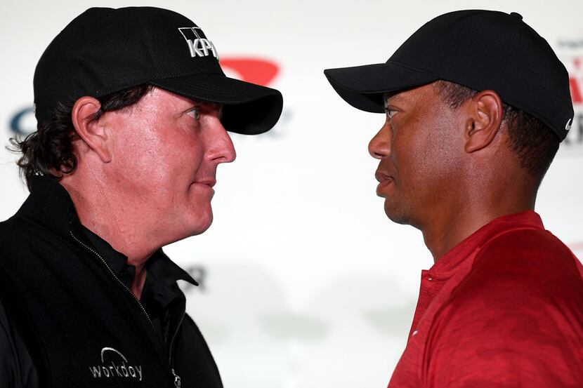 LAS VEGAS, NV - NOVEMBER 20:  (L-R) Phil Mickelson and Tiger Woods face-off during a press...