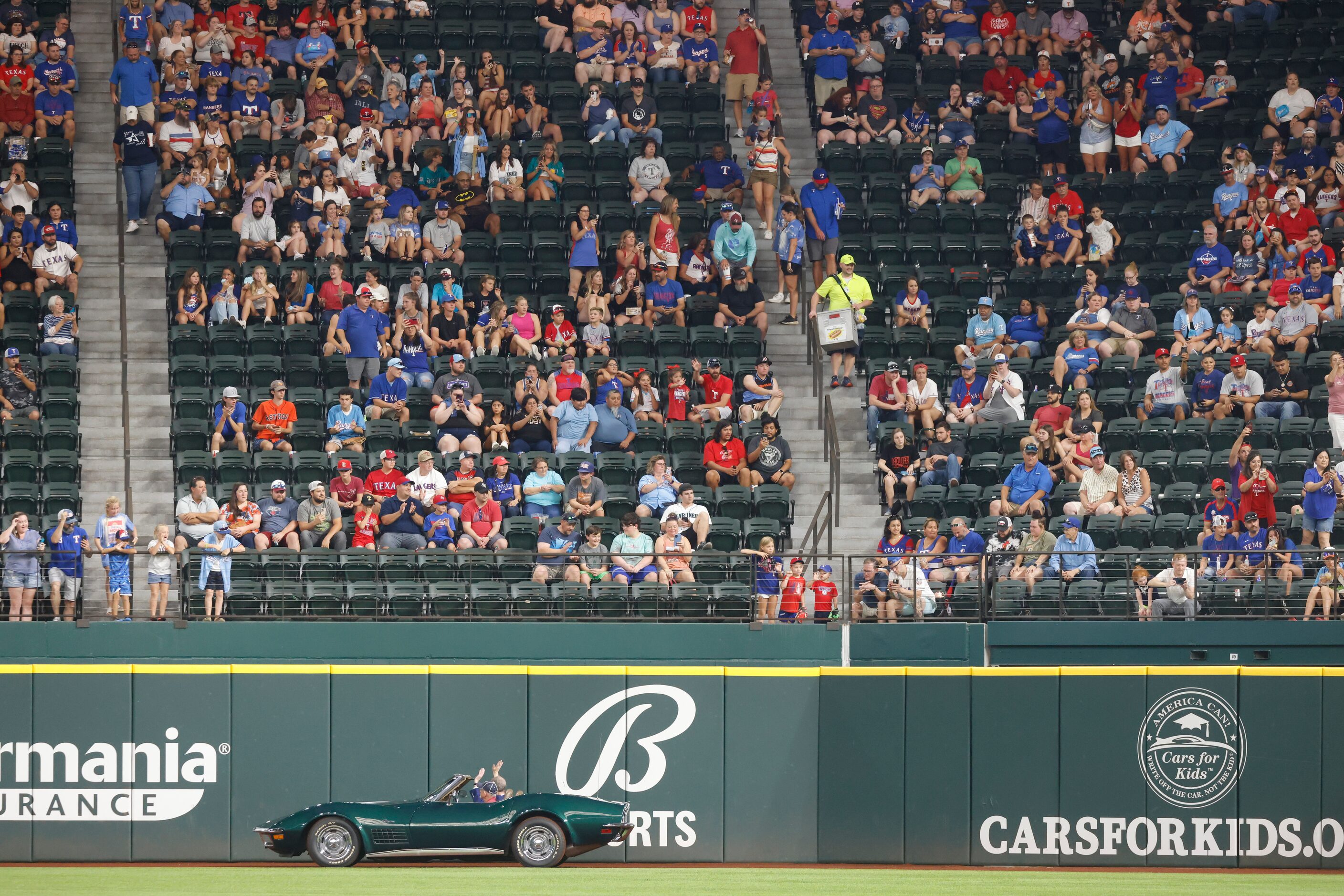 Texas Rangers media VP John Blake waves as he exits the induction ceremony at Globe Life...