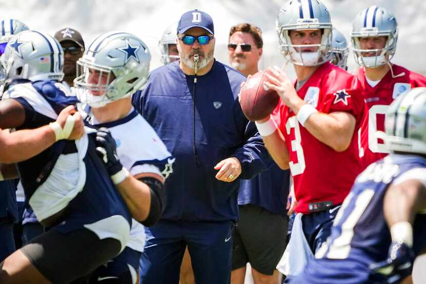 Dallas Cowboys head coach Mike McCarthy watches as quarterback Garrett Gilbert (3) runs a...