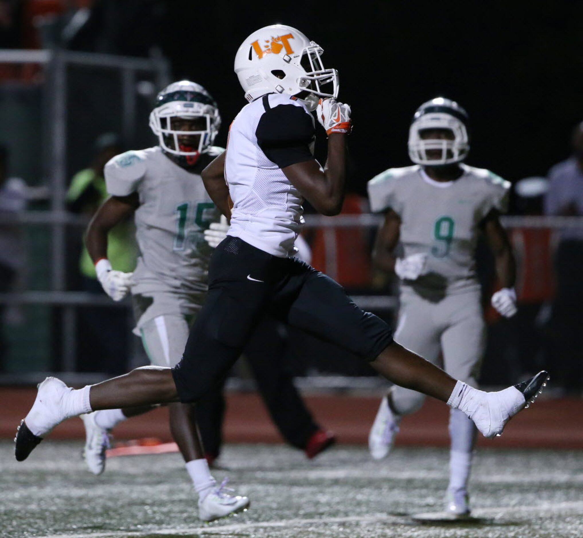 Lancaster running back Spencer Gilbert (7) rushes for a touchdown to make the score 18-27 in...